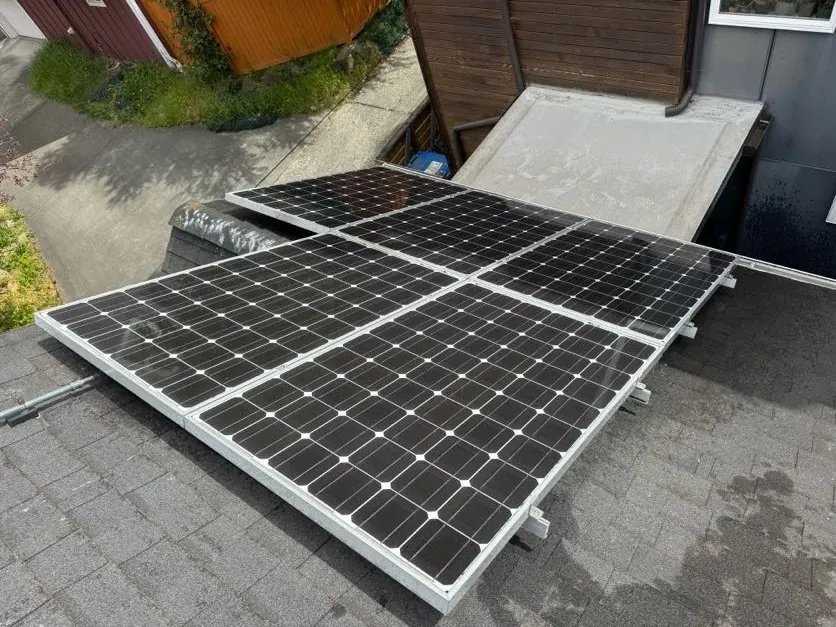 The same solar panels deep black and reflective after cleaning